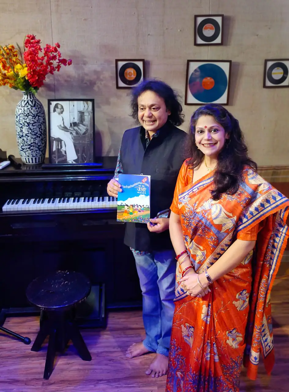 Pt Tanmay Bose and Smt Antara Chowdhury with the book 'Gaane Gaane Antara'